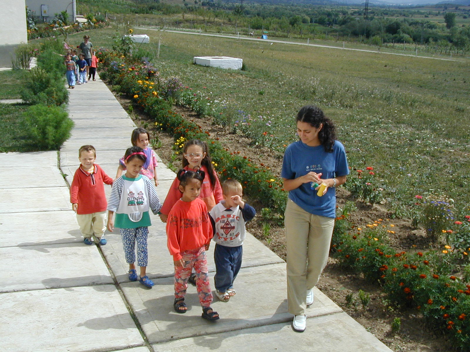 Children take an afternoon walk in the grounds at Bistritia.